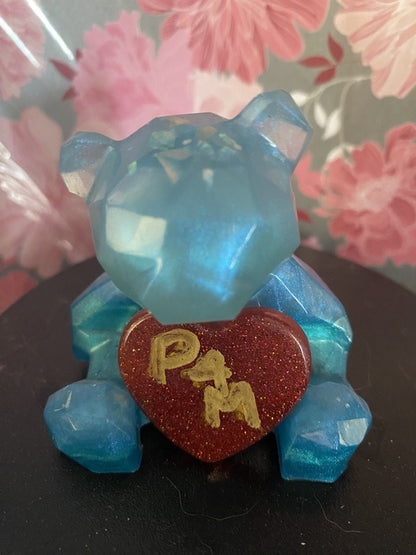 Valentines Bear with heart Piggymac Creations bear ornament in blue resin with faceted texture, holding a red glitter heart.