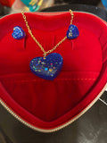 love heart pendant and earring set featuring a blue heart pendant and matching earrings in a red jewelry box.