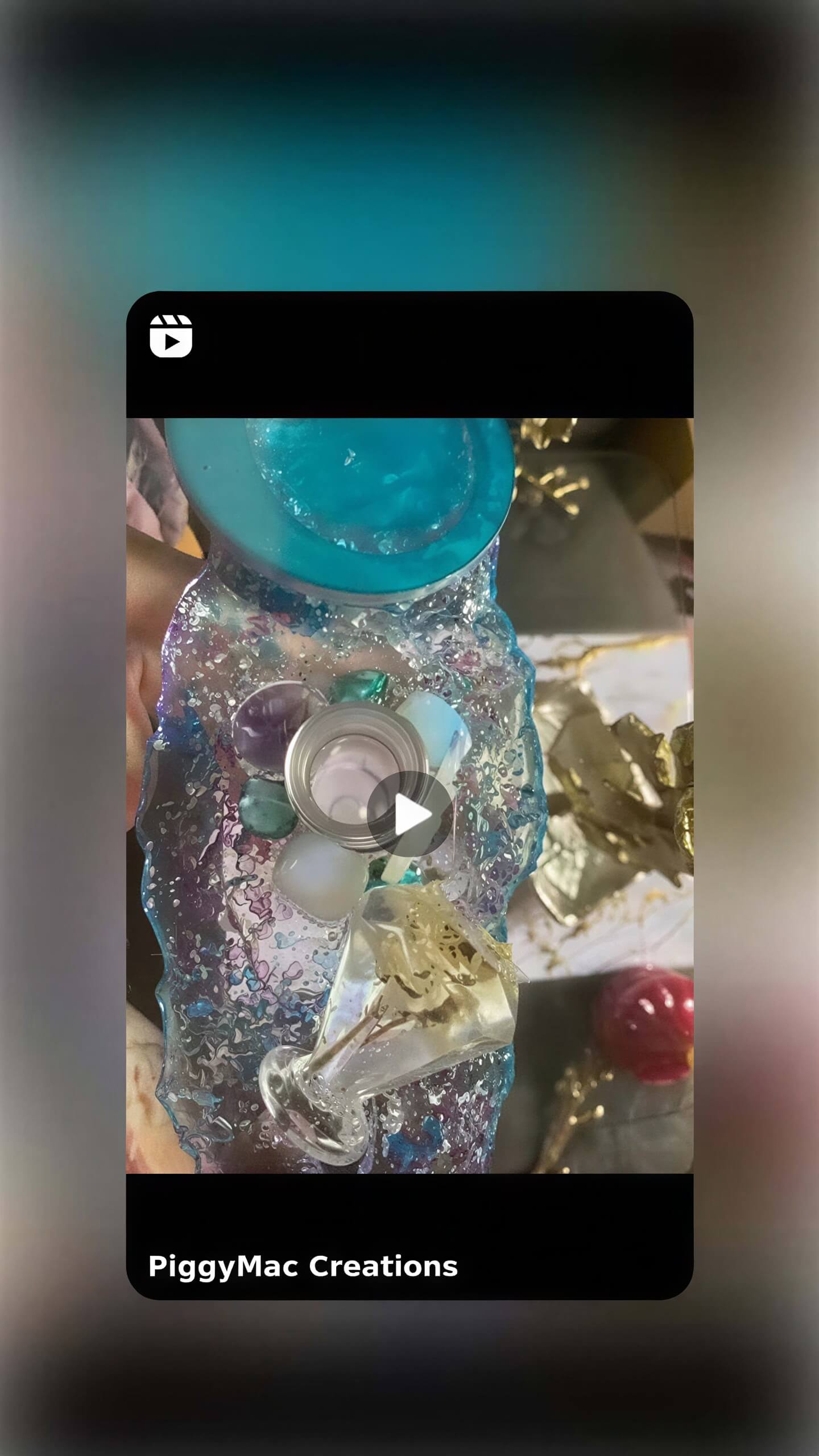 Colorful resin wine holder with a blue base, decorative elements, and a glass holder for wine.
